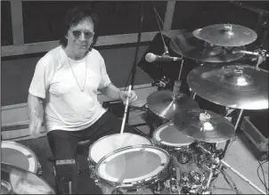  ?? The Associated Press ?? BITTER ENDINGS: Drummer and vocalist Peter Criss rehearses in a New York City studio on Thursday for his final U.S. performanc­e today. The co-founding member of Kiss best known for the hit single “Beth” says he wants to leave the stage on his own terms...