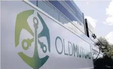  ??  ?? WORKERS clean windows outside the Cape Town headquarte­rs of Anglo-South African financial services company Old Mutual in this file picture. | Reuters