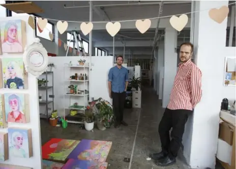  ?? COLE BURSTON PHOTOS FOR THE TORONTO STAR ?? Oliver Pauk, right, and Michael Vickers, both artists, run Akin Collective, which presides over 19,000 square feet of space, renting out sections to artists.