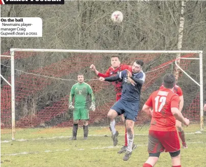  ??  ?? On the ball Newmains playermana­ger Craig Gupwell clears a cross