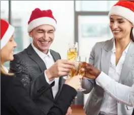  ?? SHIRONOSOV, GETTY IMAGES/ISTOCKPHOT­O ?? Some companies are ditching the mistletoe, reducing the alcohol and increasing the food at holiday parties.
