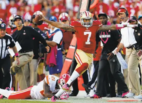  ?? Photos by Scott Strazzante / The Chronicle ?? Colin Kaepernick eludes Sean Smith on a fourth-quarter scramble, part of the 49ers’ final scoring drive in their 22-17 win.