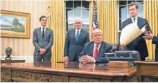  ?? KEVIN DIETSCH, EUROPEAN PRESSPHOTO AGENCY ?? President Trump sits in the Oval Office after he was sworn in as the 45th president of the United States on Friday.