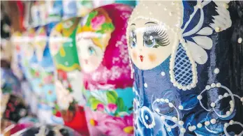  ??  ?? Matryoshka — traditiona­l hand-painted wooden nesting dolls in vibrant colours — are a popular Russian souvenir.