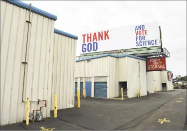  ?? Arnold Gold / Hearst Connecticu­t Media ?? One of a series of three billboards incorporat­ing religion, science and voting to travelers on southbound I-95 in West Haven on Thursday.