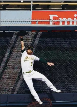  ?? MARCIO JOSE SANCHEZ — THE ASSOCIATED PRESS ?? A’s left fielder Robbie Grossman cannot catch a solo home run hit by the Astros’ Alex Bregman during the fourth inning of Game 1 of the American League Division Series in Los Angeles on Monday.