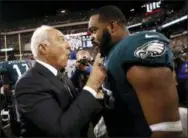  ?? FILE ?? Defensive end Brandon Graham, right, wouldn’t mind receiving a contract extension from Eagles owner Jeffrey Lurie. However, if the Eagles decide to extend quarterbac­k Carson Wentz, Graham may have to go elsewhere to get the big money.