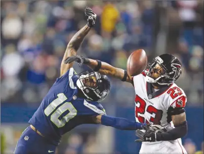  ?? The Associated Press ?? Seattle Seahawks receiver Paul Richardson, left, fails to haul in a pass as Atlanta Falcons’ Robert Alford defends during second-half NFL action on Monday in Seattle.The Seahawks lost 34-31.
