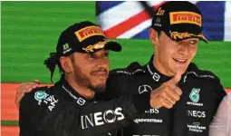  ?? ?? Finally a one-two: second placed mercedes driver Lewis Hamilton (left) and teammate George russell celebrate on the podium.
