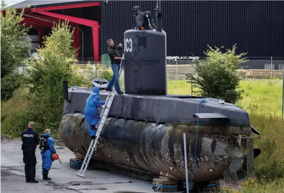  ?? AP ?? Police technician­s board Nautilus on a pier in Copenhagen harbour. Its role in the death and disappeara­nce of Kim Wall is yet to be establishe­d