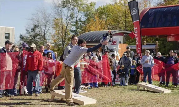  ??  ?? TAKE AIM: Register your team for the New England Cornhole Championsh­ip during Sunday River’s Fall Festival.