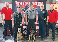  ?? LeFlore County Sheriff’s Department Deputies Cindy Hicks, second from left, and Chase Blake, center, along with their respective K9 dogs Kia and Joker, after they spent about an hour doing what Poteau High School principal Joe Ballard called a “soft searc ??