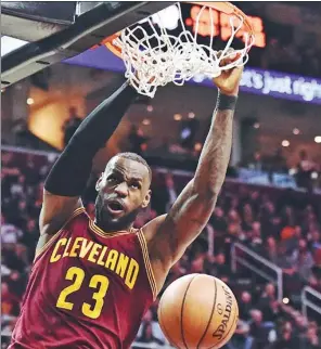  ?? USA TODAY SPORTS ?? Cleveland Cavaliers forward LeBron James dunks during the second half of Wednesday’s 125-97 trouncing of the Minnesota Timberwolv­es at Quicken Loans Arena in Cleveland.