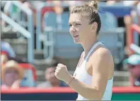  ?? $1 1)050 ?? Simona Halep of Romania celebrates her victory over Karolina Pliskova of the Czech Republic during third round of play at the Rogers Cup tennis tournament Thursday in Montreal.