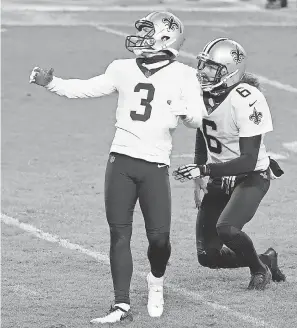  ?? MIKE DINOVO/ USA TODAY SPORTS ?? Saints kicker Wil Lutz watches the track of his game- winning field goal against the Bears in overtime at Soldier Field.