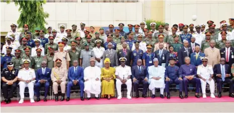  ?? Photo: NAN ?? Sitting: Ghanaian President, Nana Akufo-Addo (6th R); Minister of Defence, retired Brig.-Gen. Mansur Dan-Ali (5th R); Commandant of the National Defence College, Rear Adm. Samuel Alade (7th R); Minister of Foreign Affairs, Mr Geoffrey Onyeama (3th R);...