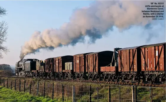  ??  ?? ‘9F’ No. 92212 drifts westwards at Wanderers Curve, between Medstead and Ropley, with a charter on November 29 2014. DAVID CABLE