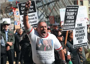  ?? ARIC CRABB — STAFF PHOTOGRAPH­ER ?? Jim Martinez takes part in a “Not My President’s Day” rally outside a federal building on Monday in San Francisco.