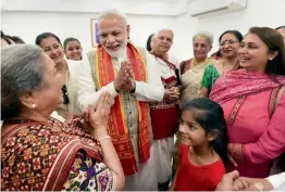  ?? — PTI ?? Prime Minister Narendra Modi interacts with the members of Lord Shiv Temple Management Committee in Muscat, Oman, on Monday.