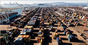  ?? ASSOCIATED PRESS ?? Containers line a Port of Oakland shipping terminal Nov. 10 in Oakland, California. Intense demand for products has led to a backlog of container ships at the nation’s ports.