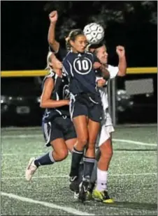  ?? Photos by John Gleeson ?? Amanda Nicholas wins a header for Council Rock South in a recent soccer duel with Pennsbury won by the lady Falcons.