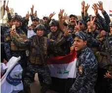  ?? AFP ?? The Iraqi forces celebrate in the Old City of Mosul on July 10 after liberating the city following a long battle with ISIL