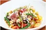  ??  ?? Mediterran­ean salad with raw tuna, Israel couscous, tomato, and beans