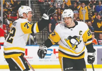  ?? GETTY IMAGES ?? Patric Hornqvist, Sidney Crosby and rest of the Penguins appear playoff-bound again. Pittsburgh has made 13 straight playoff appearance­s — while winning three Cups — by far the longest streak in the NHL.