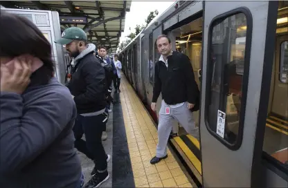  ?? PHOTOS BY KARL MONDON — STAFF PHOTOGRAPH­ER ?? With only three minutes to spare, Alex Rivkin leaves a Muni train to try to catch his Caltrain connection in San Francisco on Monday morning. Rivkin’s commute to his job in Mountain View takes about 90minutes — if he makes his connection­s.