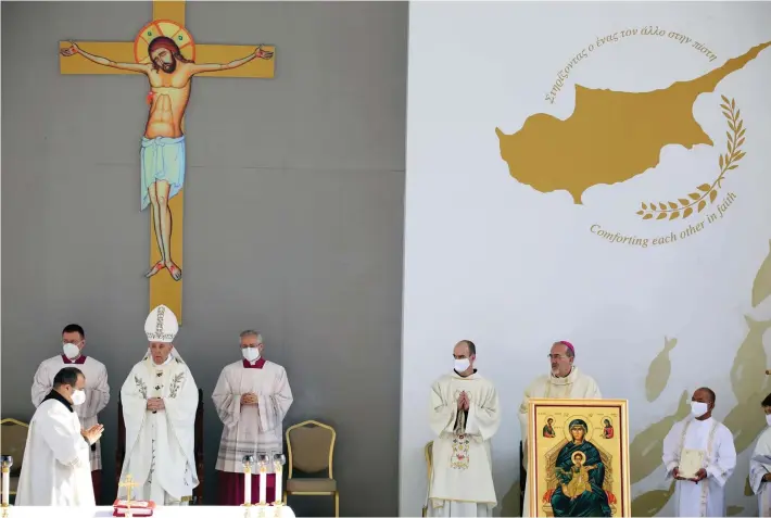  ?? ?? Pope Francis leads a Holy Mass at GSP stadium in Nicosia, Cyprus yesterday. Pope Francis is on a five-day trip to Cyprus and Greece by drawing attention once again to his call for Europe to welcome migrants. Photo: Philippos Christou/AP