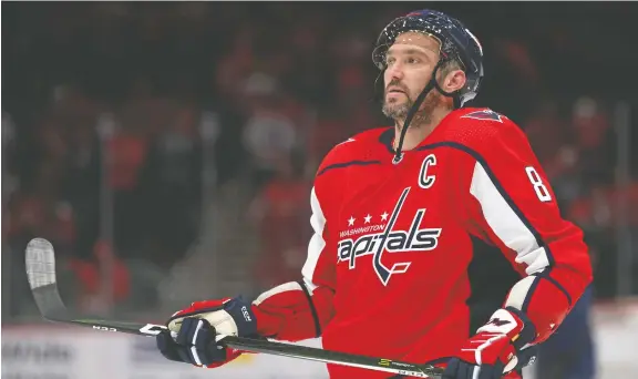  ?? PATRICK SMITH/GETTY IMAGES FILES ?? Russian hockey star Alex Ovechkin still features a photo on Instagram of himself smiling alongside his autocratic leader, President Vladimir Putin.