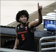  ??  ?? Oregon State guard Ethan Thompson celebrates after a Sweet 16game against Loyola Chicago in the NCAA Tournament at Bankers Life Fieldhouse on Saturday in Indianapol­is. Oregon State won 65-58.