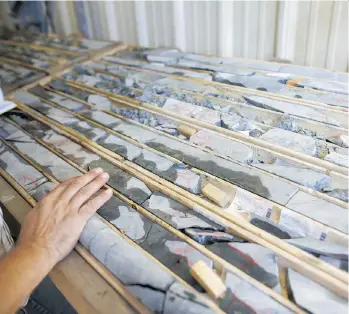  ?? COLE BURSTON/BLOOMBERG ?? Core samples are displayed at the First Cobalt Corp. facility outside of Cobalt, Ont. Global demand for cobalt, a component in batteries used to power electric cars for automakers such as Tesla Inc., is renewing interest in the metal and the impoverish­ed town that once thrived on silver.