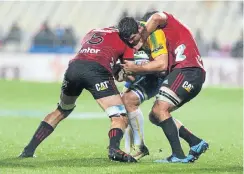  ?? Picture: Getty Images ?? Bulls loose forward Marco van Staden is caught in possession by two Crusaders players in Friday’s Super Rugby match. The Crusaders won 33-14.