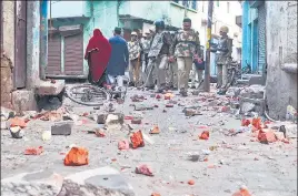  ?? PTI ?? Police patrol the area after clashes broke out during anti-CAA protests in Aligarh on Sunday.