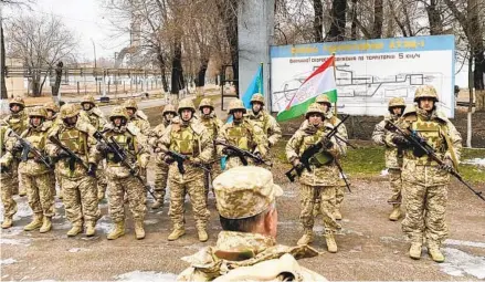  ?? AP ?? In this photo released by the Russian Defense Ministry Press Service, members of the Russian-led Collective Security Treaty Organizati­on military alliance attend a briefing Tuesday before guarding an area in Almaty, Kazakhstan. The troops are set to withdraw soon.