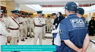  ?? ?? Al Marri speaking with the staff of the General Department of Criminal Evidence and Criminolog­y during his inspection visit