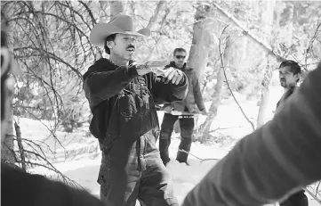  ??  ?? Director Taylor Sheridan on the set of ‘Wind River', his first movie as a director. Sheridan previously wrote screenplay­s for two other modern takes on the traditiona­l Western.