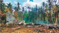  ?? AFP ?? Smoke billows from the wreckage of a Philippine Airforce C-130 transport plane after it crashed near the airport in Jolo town, near Sulu province, on July 4, 2021.