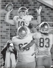  ?? AP-Gerry Broome ?? Notre Dame wide receiver Chris Finke (10) is congratula­ted by teammates following Finke’s touchdown against Duke during the second half of a game in Durham, N.C.