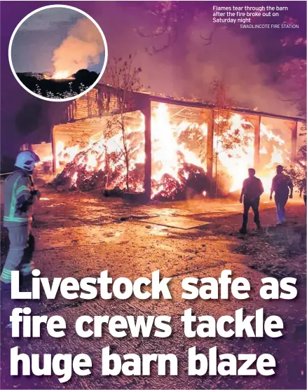  ?? SWADLINCOT­E FIRE STATION ?? Flames tear through the barn after the fire broke out on Saturday night