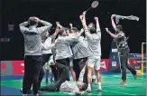  ?? AP/AFP ?? (Left) Srikanth Kidambi after winning a point against Indonesia's Jonatan Christie; (above) members of the Indian men’s team celebrate after winning their first Thomas Cup crown.