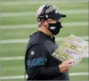  ?? MICHAEL AINSWORTH — THE ASSOCIATED PRESS ?? Philadelph­ia Eagles head coach Doug Pederson watches play against the Dallas Cowboys in the second half of an NFL football game in Arlington, Texas, Sunday.