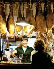  ??  ?? cut above: Hanging hams in San Sebastian