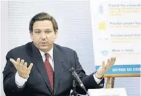  ?? BOB SELF/AP ?? Gov. Ron DeSantis addresses a panel in Jacksonvil­le Tuesday. DeSantis recently attended a conference with four public officials who have tested positive for COVID-19, raising the total to seven in the state.