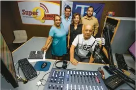  ?? IVY CEBALLO/TAMPA BAY TIMES ?? From left, coordinato­r Orfelina Reyna, owner Norberto Vallejo, radio personalit­y Madeline Rivera, CEO Cristian Vallejo, and radio personalit­y Luis Maisonet pose for a picture in the studio at Super Q WQBN Radio in Tampa in August.