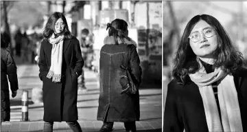  ??  ?? This picture taken on Dec 22 shows Wang Zhaoyue, a 24-year-old recent master’s graduate, walking along a street in Beijing. While their country’s leader has encouraged citizens to work harder and dream big, some Chinese millennial­s are declaring their...