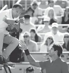  ??  ?? Juan Martin del Potro argues a call with umpire Mohamed Lahyani during his match against Denis Shapovalov during the Rogers Cup in Montreal on Wednesday. Shapovalov called it a “huge honour” to play del Potro.