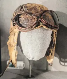  ??  ?? These cap and goggles show where a bullet struck the Japanese pilot who wore them. They’re on display at the National Museum of the Pacific War.