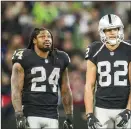  ?? BETTINA HANSEN/TRIBUNE NEWS SERVICE ?? Then-Raiders running back Marshawn Lynch, left, and receiver Jordy Nelson watch a replay on Oct. 14, 2018 at Wembley Stadium in London.